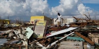 A man looks for salvageable items in the aftermath of Hurricane Melissa in Black River, Jamaica, Thursday, Oct. 30, 2025.