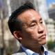 David Chiu stands outside